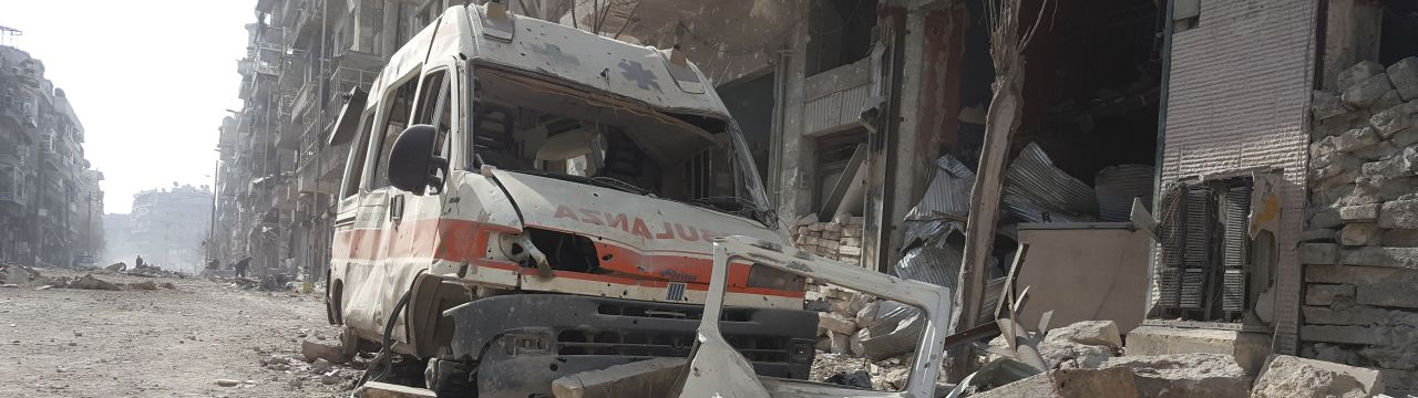 Syria, Aleppo, Al-Kallaseh district. The remains of an ambulance in the debris. 