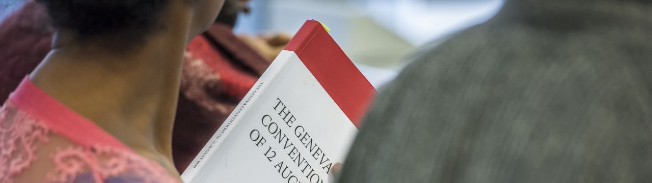 Student of the Executive Master in International Law in Armed Conflict with the book the Geneva Conventions