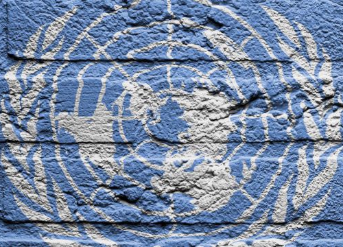 UN Flag painted on a brick wall