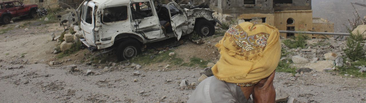 Yemen, Saada, Haydan district, Fawt. Looking at his destroyed home and smashed car, a man is overwhelmed by sadness. 