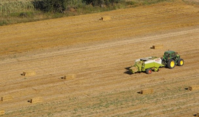 Tractor at work in a field (Mombaldone, Piemonte, NW Italy)