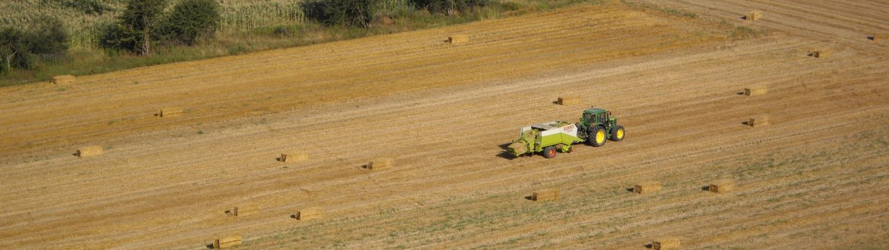 Tractor at work in a field (Mombaldone, Piemonte, NW Italy)