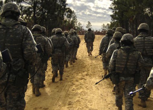 U.S. Army recruits practice patrol tactics while marching during U.S. Army basic training at Fort Jackson, S.C., Dec. 6, 2006