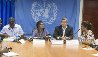 Two Commissioners of a three-member team from the UN Commission on Human Rights speak to Journalists at a press conference.