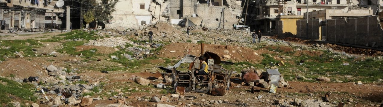  Outskirts of Aleppo. Kids playing with burnt chairs. 