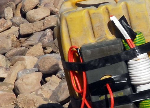 an Improvised Explosive Device while searching in the Mirabad Valley Region, Afghanistan 