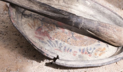 Nigeria, a broken plate on the ground: Maiduguri, Jiddari Polo area. Items brought by displaced persons to represent the things they left behind.