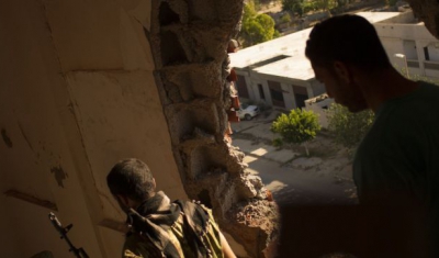 Libya, Fighters are seen in a house during an attack against militants. 