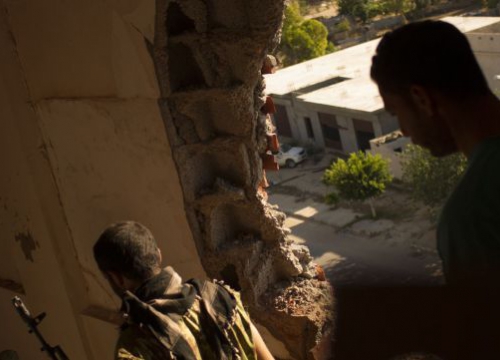 Libya, Fighters are seen in a house during an attack against militants. 