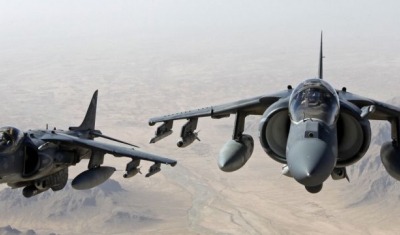 AV-8B Harrier jets with Marine Attack Squadron 311 fly over Helmand province, Afghanistan, June 10, 2013