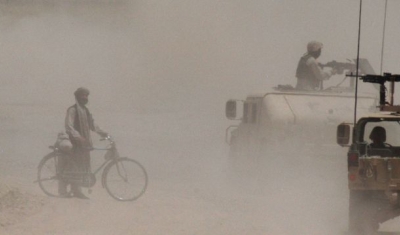 Afghanistan, Khandahar. After a road bomb destroyed a US Army vehicle, troops are patrolling the area to look for clues. 