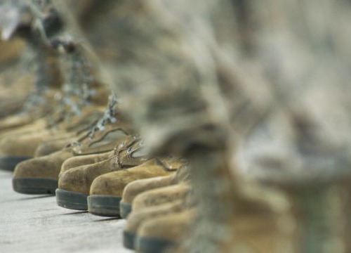 Crew chiefs from the 5th Aircraft Maintenance Squadron (US Aif Force) stand on the flight line to watch the minimum-interval takeoff at Minot Air Force Base, 15 August 2013.