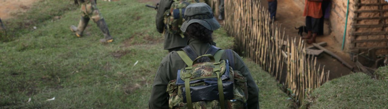 Colombia, 2010: Mountains in the Valle del Cauca region, between Santander de Quilichao et Popayan. FARC-EP (Revolutionary Armed Forces of Colombia) combattants walking next to native houses. 