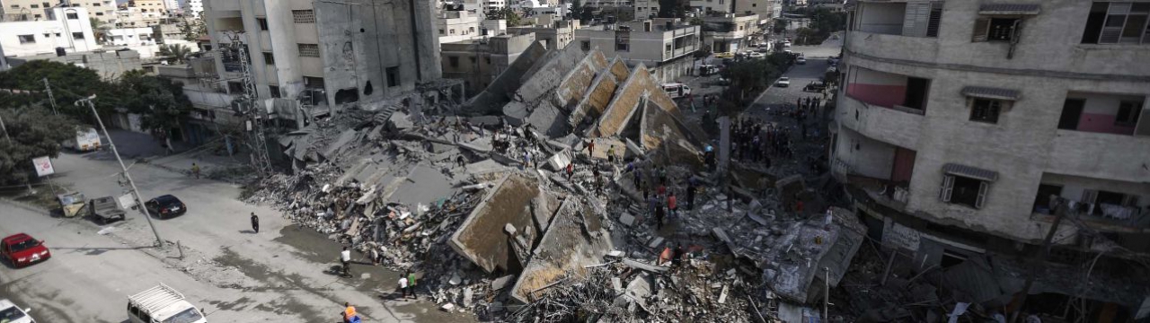 Gaza City. Palestinians check the remains of Al-Basha, a building that was destroyed by an Israeli air strike in 2014