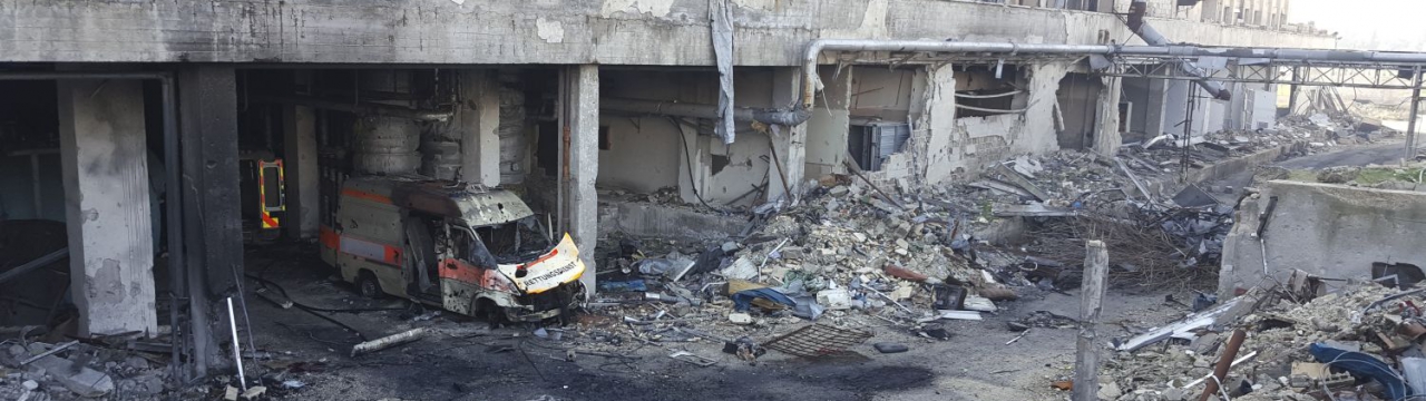 Syria, destroyed building and ambulance