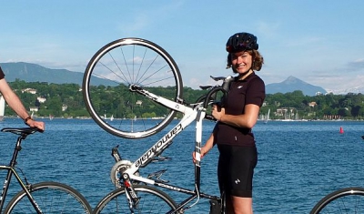 The four LLM students with their bicycle