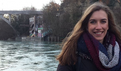 Annabelle Gagnon, LLM student at the Geneva Academy, in front of the Pointe de la Jonction in Geneva