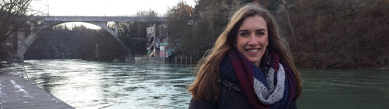 Annabelle Gagnon, LLM student at the Geneva Academy, in front of the Pointe de la Jonction in Geneva