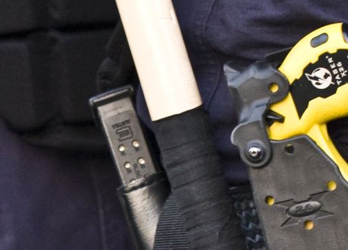 Belt of police officers with a Taser