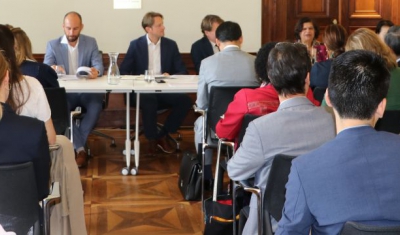 Photo of the conference room with participants