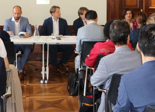 Photo of the conference room with participants