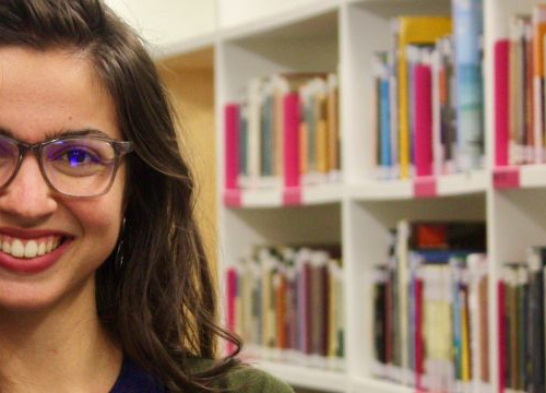 Portrait of Anthoula Bourolias in the Library of the Graduate Institute of International and Development Studies