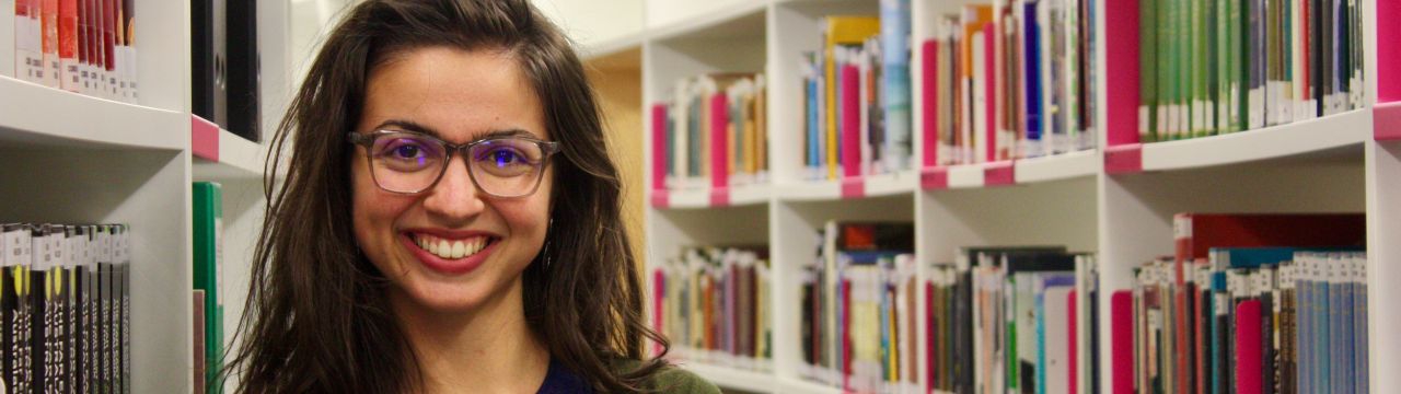 Portrait of Anthoula Bourolias in the Library of the Graduate Institute of International and Development Studies