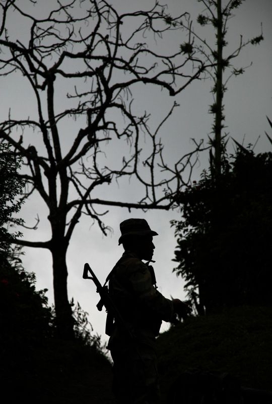 Colombia,  Mountains in the Valle del Cauca region, between Santander de Quilichao et Popayan. FARC-EP (Revolutionary Armed Forces of Colombia) combattant. 