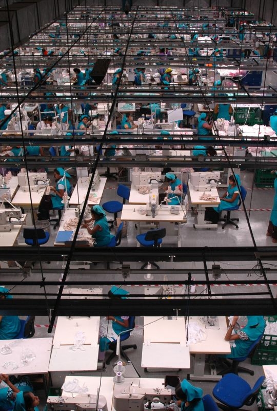 Garment factory, Sri Lanka  Workers at their stations on the garment production line.