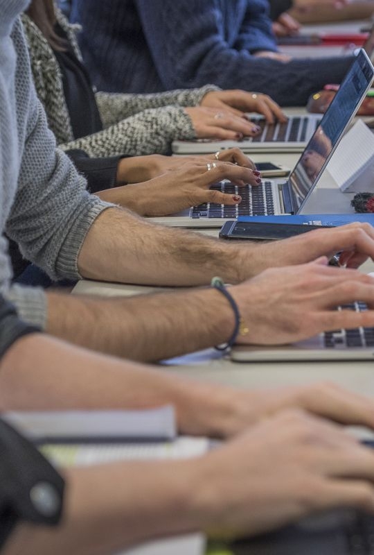 Students typing during a class