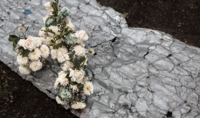 Peru, Chungui district, Totora village. Flowers wait to be placed on top of the gravesite for Marcelino's mother and three younger siblings. 