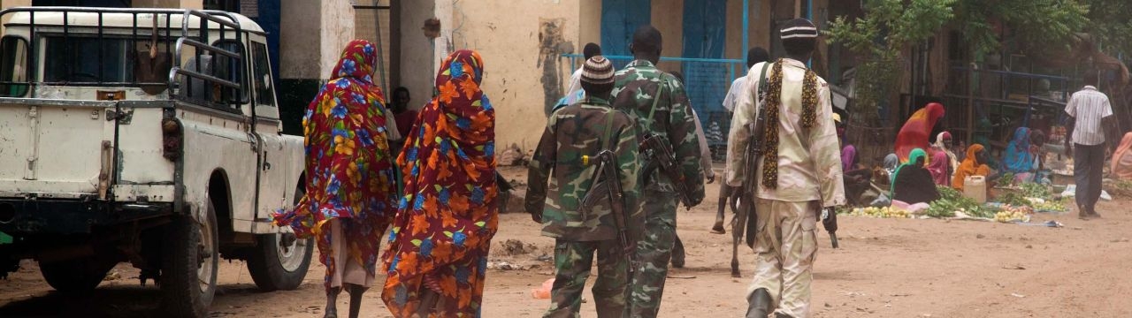 Kutum, North Darfur: Members of the Sudanese army patrol Kutum market