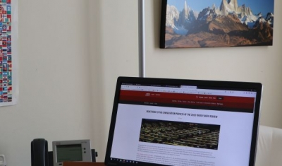 Felix Kirchmeier, Executive Director of the Geneva Human Rights Platform, in front of his computer