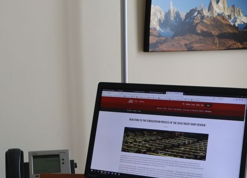 Felix Kirchmeier, Executive Director of the Geneva Human Rights Platform, in front of his computer