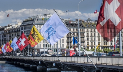 Flags of the Geneva Human Rights Platform fly over the Mont-Blanc Bridge in Geneva