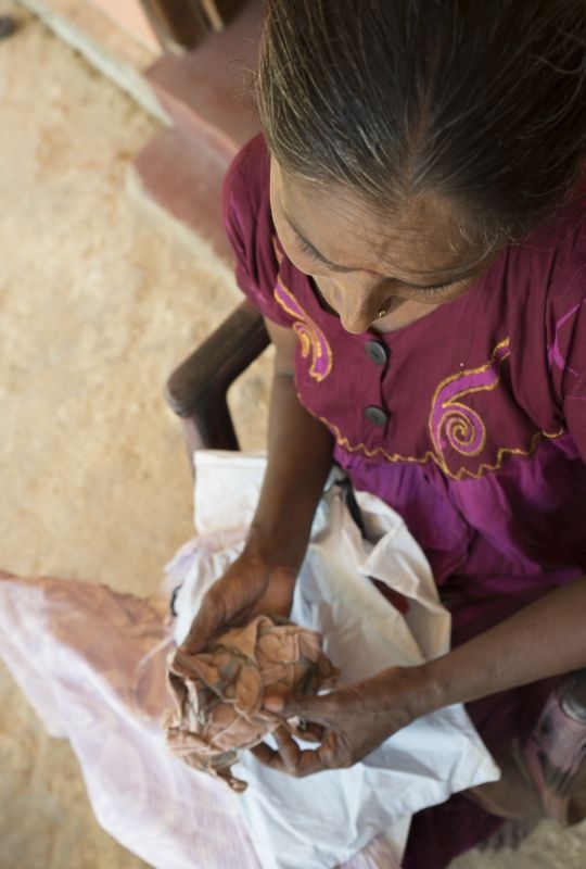  Kilinochchi. ICRC program for families of missing person. A woman carefully preserves a handkerchief and the clothes her daughter wore the day before she went missing. 