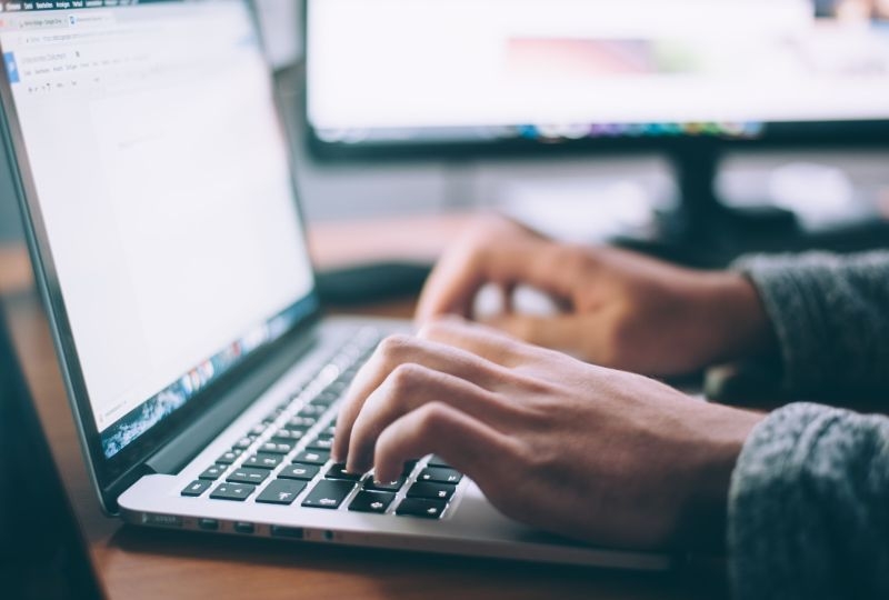 Person typing on a laptop