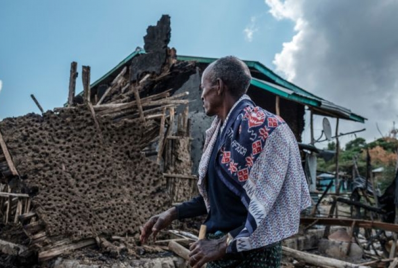 A man before a destroyed building, Tigray, Ethiopia