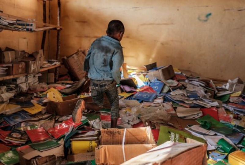 Destroyed school with a kid in a classroom, Tigray, Ethiopia