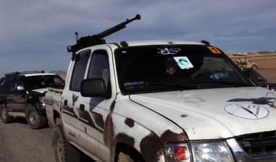 A Private Afghan Security Company technical armed with a DShK heavy machine gun sits along the side of a road. U.S.Forces stopped this security company's convoy due to reports from locals claiming that the security company had been shooting sporadic gunfi