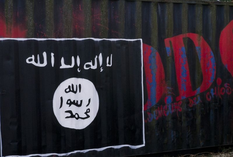Flag of the Islamic State painted on a wall