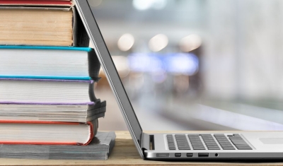 Books' pile and a laptop