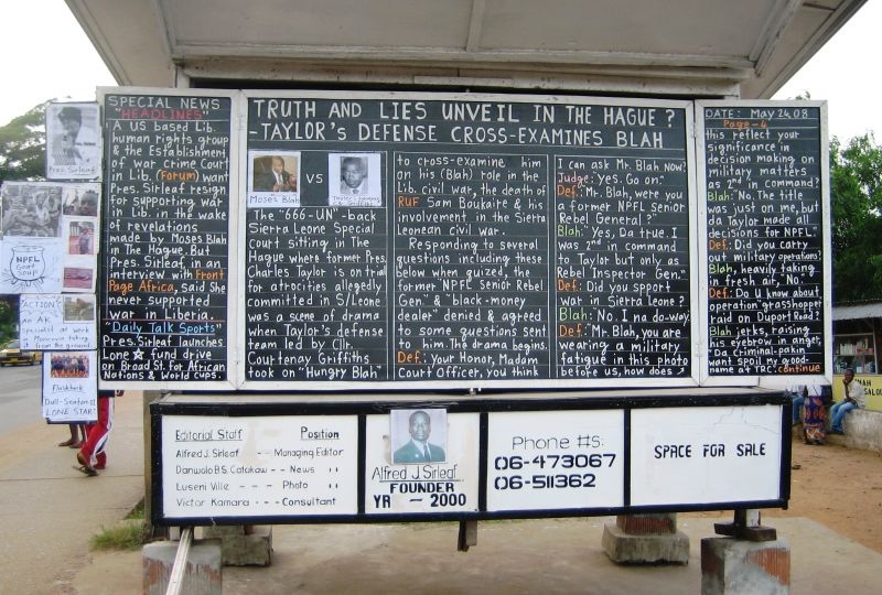 MONROVIA, Liberia - A daily news chalk board in Monrovia, Liberia,  displays the latest headlines on the trial of former Liberian president Charles Taylor at the International Criminal Court in The Hague