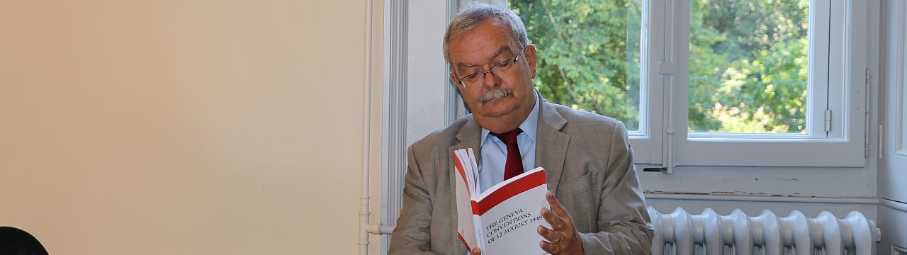Marco Sassoli reading the Geneva Conventions