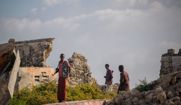 Armed Somali men stand guard over-looking Lido Beach 06 August 2012, in the Kaaraan Districtl in the Somali capital Mogadishu. 