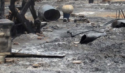 A destroyed camp for internally displaced persons (IDPs) in Khor Abeche, South Darfur,